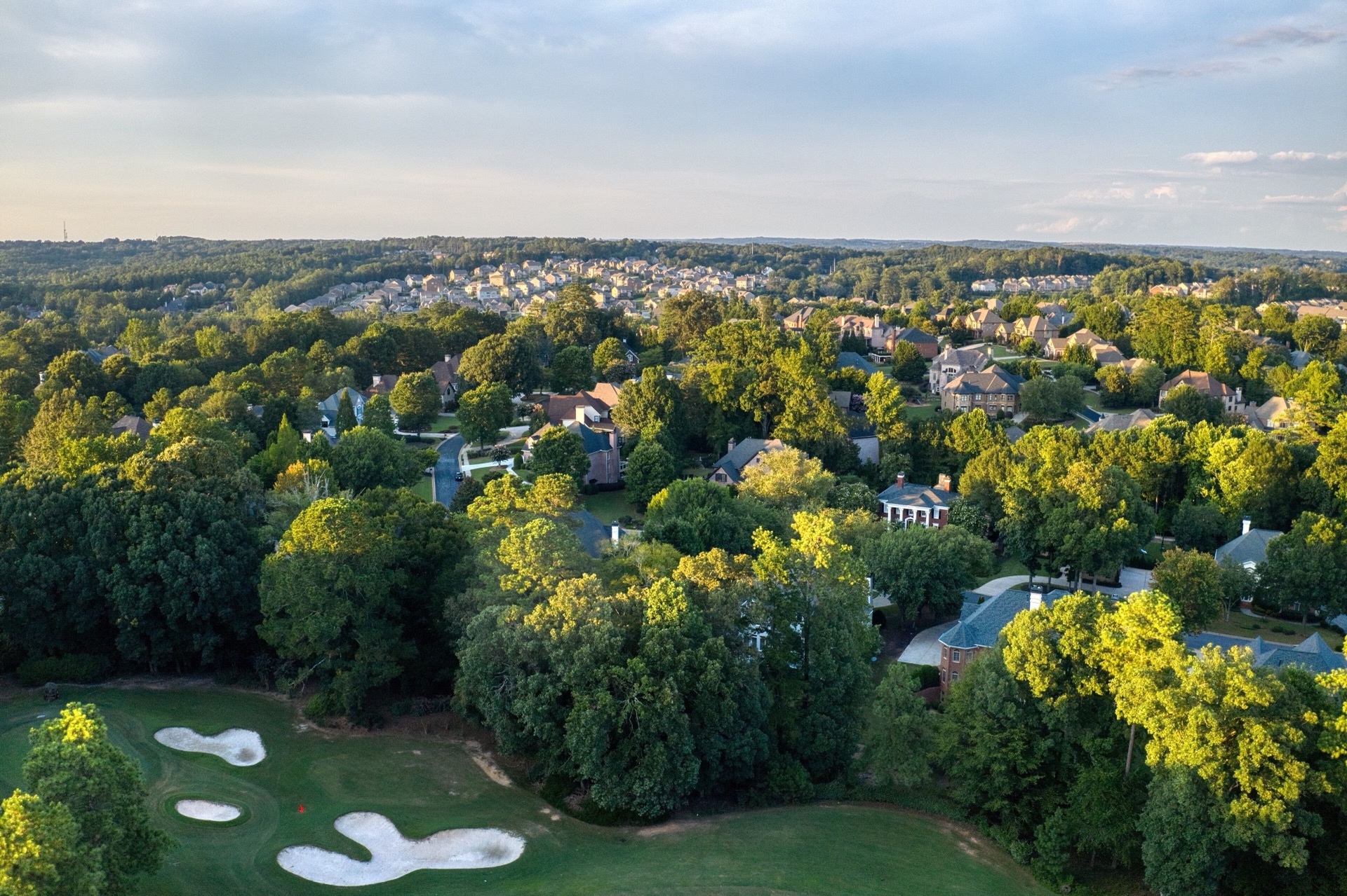 Aerial view of a luxury Rockwall County neighborhood at sunset